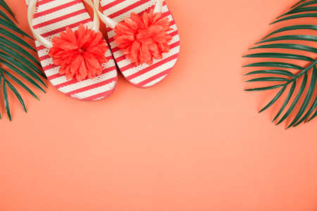 beach accessories on color background - sunglasses, towel. flip-flops and striped hat. summer is...