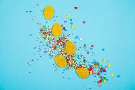 Gold paper eggs on blue background. Easter layoutの写真素材