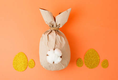 Creative Paper bunny on coral background. Easter layoutの写真素材