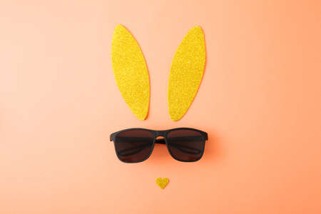Creative easter background with bunny ears and sunglassesの写真素材