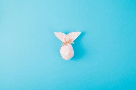 Creative paper rabbit on color background. Easter layoutの写真素材