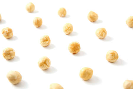 Nuts pattern - hazelnut on white background. Concepts about decoration, healthy eating and food backgroundの写真素材