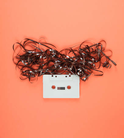 retro white audio cassette tape on color background. Creative layout.の写真素材
