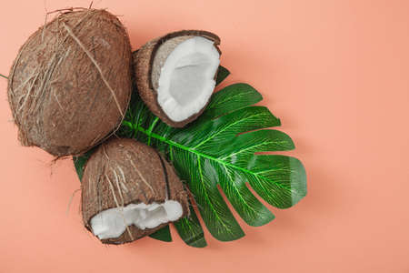 Fresh coconut on coral background. Food ingredients. Health foodの写真素材