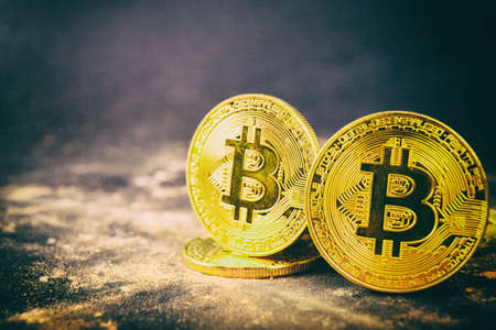 Gold bitcoin on black background. Crypto-currency conceptの写真素材