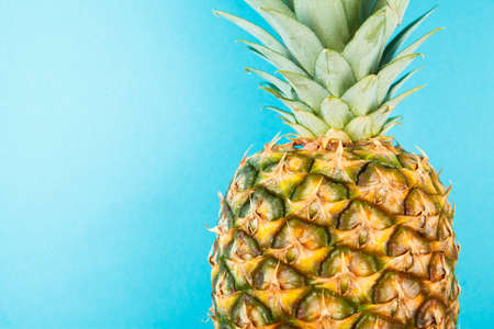 Fresh ripe pineapple on blue background. Food ingredientsの写真素材
