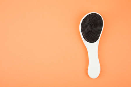 Hairbrush isolated on coral background with clipping pathの写真素材