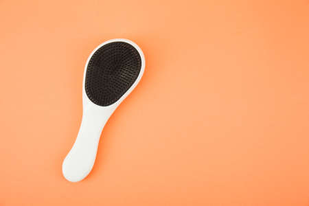 Hairbrush isolated on coral background with clipping pathの写真素材