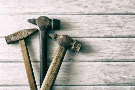 Old hummer on wood desk with place for textの写真素材