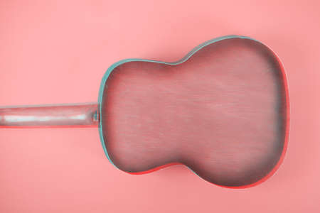 Glitch effect. Acoustic guitar resting on color background with copy space. Modern conceptの写真素材