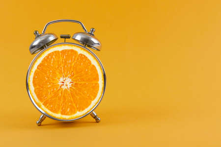 Layout fresh orange slice alarm. Fitness conceptの写真素材