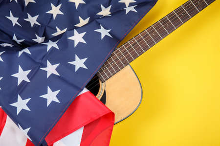 Part of Acoustic guitar resting on color background with copy space. Modern conceptの写真素材