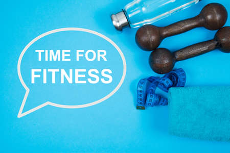 Fitness background with bottle of water, sport shoes on color texture
