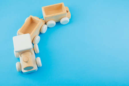 Wooden train on blue background. Toysの写真素材