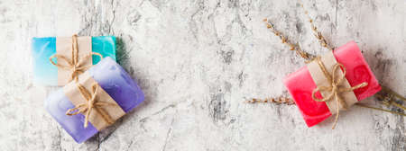 fragrant handmade soap lies on a circular base on a wooden background