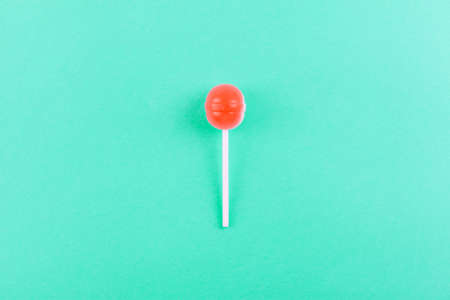 lolipop on mint blue pastel background.sweet candy conceptの写真素材
