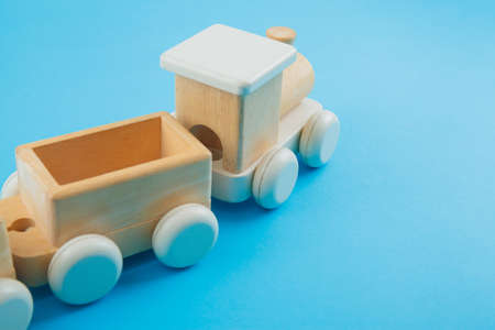 Wooden train on blue background. Toysの写真素材