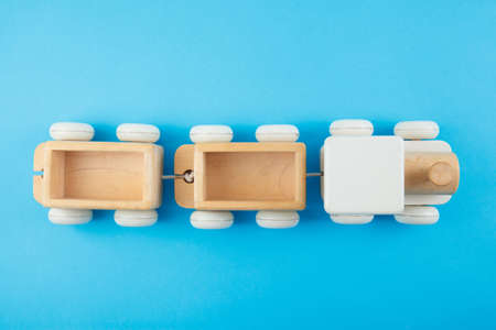 Wooden train on blue background. Toysの写真素材