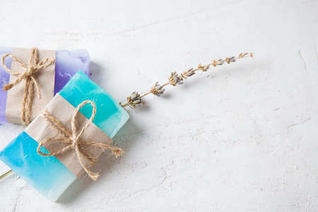 fragrant handmade soap lies on a circular base on a wooden background