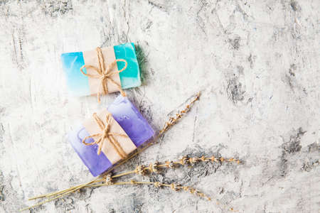 fragrant handmade soap lies on a circular base on a wooden background