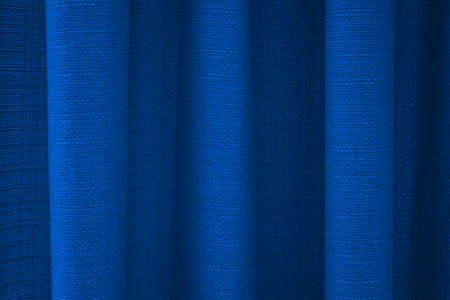 Fabric blue curtains with folds . Abstract background, curtain, drapes blue fabric.