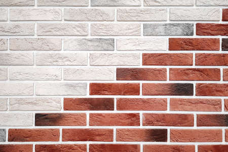 Decorative brickwork background of red and white bricks laid out diagonally.