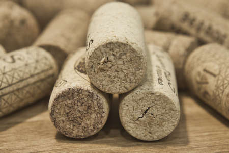 Bunch of wine corks on wooden table. Wine drink.の写真素材