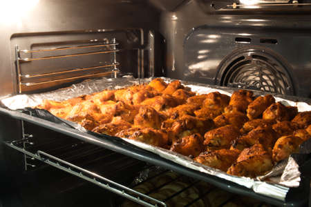 Chicken wings baked in the oven to crispy crust. Chicken BBQ. Home cooking concept.の写真素材