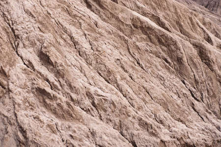 Natural landscape of red rocks slope looks like martian landscape. Textured background.