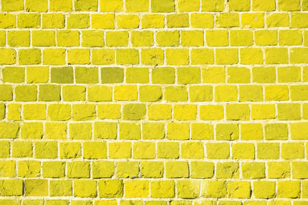 Yellow brick wall. Background of an old brick building.の写真素材
