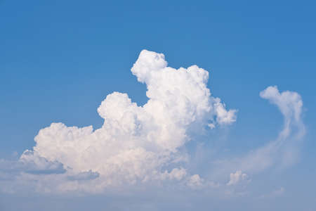 White clouds on the blue sky at sunny day