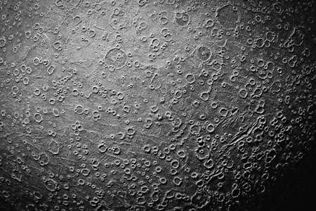 Surface of the moon with impact craters. Model of the moon. Black and white image.の写真素材