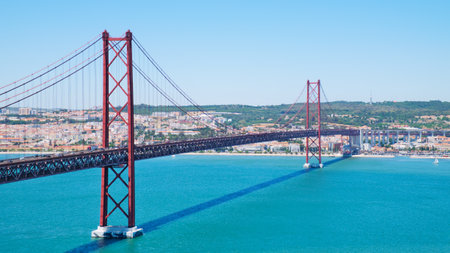 The 25 April bridge in Lisbon above the Tejo river.の写真素材
