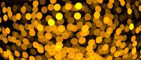Golden lights bokeh background banner. Christmas, New Year, holidays decoration.