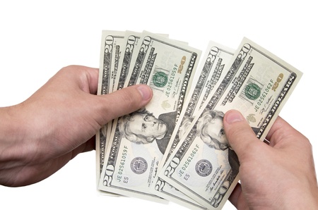 Hands recalculate U S  dollars isolated on white backgroundの写真素材