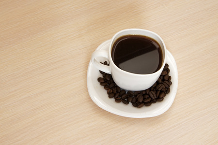 Cup of coffee on a wooden backgroundの写真素材