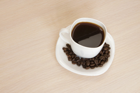 Cup of coffee on a wooden backgroundの写真素材