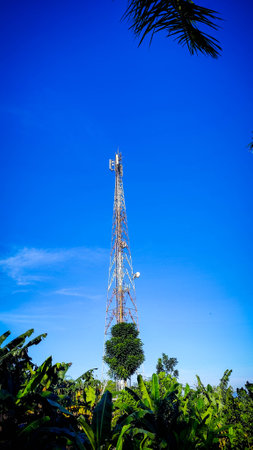 a tall metal tower with a blue skyの写真素材