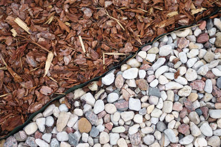 Some gray stones on the board of sod の写真素材