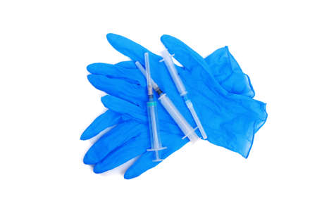 top view on disposable medical gloves and syringe isolated on white backgroundの写真素材
