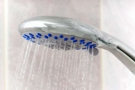 closeup of water running from shower headの写真素材