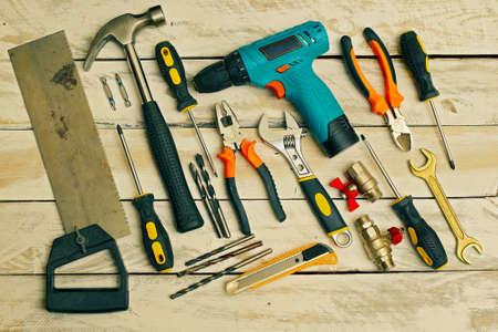 top view of set of hand tools on wooden background, color gradedの写真素材