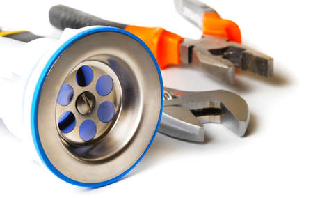 closeup of kitchen drain assembly and plumbing tools on white backgroundの写真素材