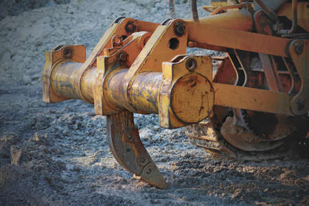 closeup of ripper or single shank on the back of the bulldozer