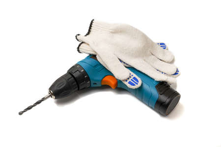 drill machine with work gloves on white background