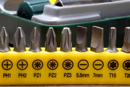closeup on screwdriver bit set in front of toolbox, macroの写真素材