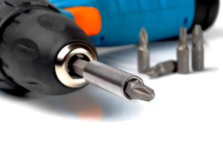 screwdriver bit fixed in drilling machine chuck, macro, shallow depth of field