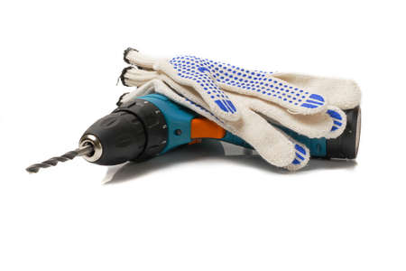 drill machine with work gloves on white background