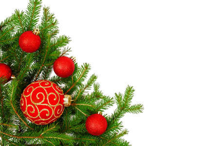 green spruce branches border with red christmas balls isolated on white background, corner designの写真素材