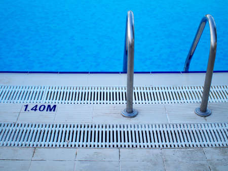 swimming pool in-pool ladder and depth markerの写真素材